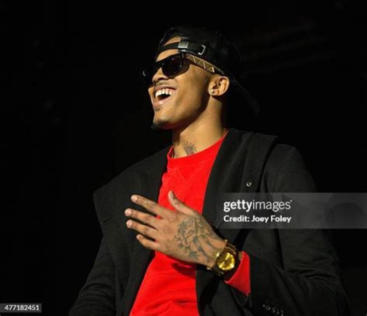 August Alsina performs live on stage in a red jacket and red hat at Indigo at The O2 Arena